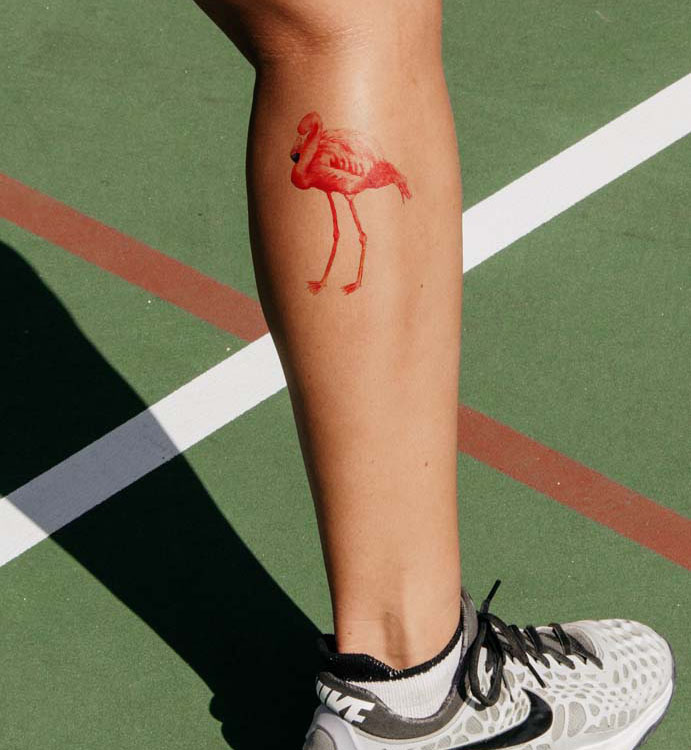 Tattoo on calf. Tattoo motif flamingo. Flamingo as tattoo.