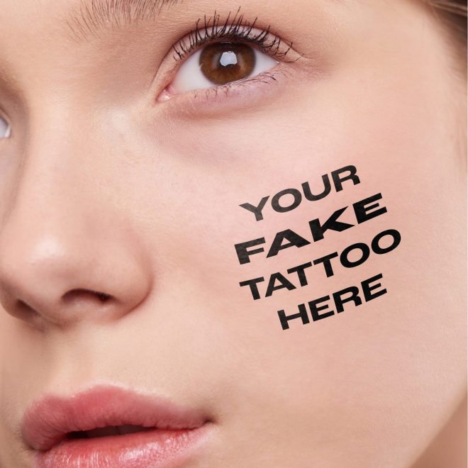 Girl, woman with the text "Your Tattoo Here" tattoo on her cheek.