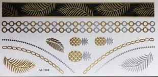 Fake tattoos in gold and silver color. The tattoos have a pattern of golden leaves, pineapples, and stylish designs.