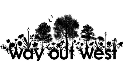 Svartvit Way out West-logotyp med silhuetter av blommor, träd, gatlyktor och flygande fåglar ovanför texten - en perfekt design för fans av Temporary Tattoo Industry.